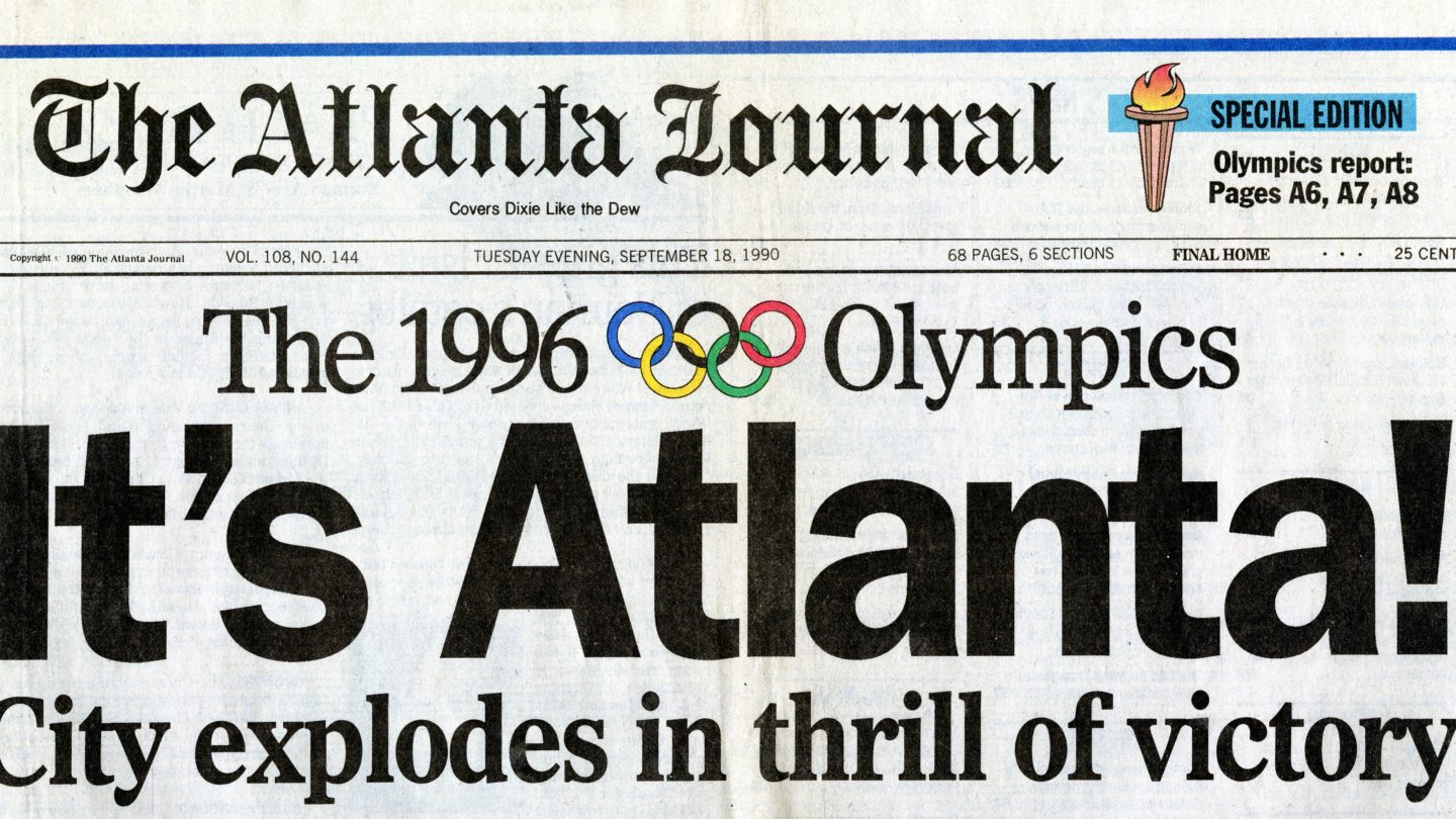 Newspaper clipping of the Atlanta-Journal with the headline "It's Atlanta!" and subtitle "City explodes in thrill of victory"