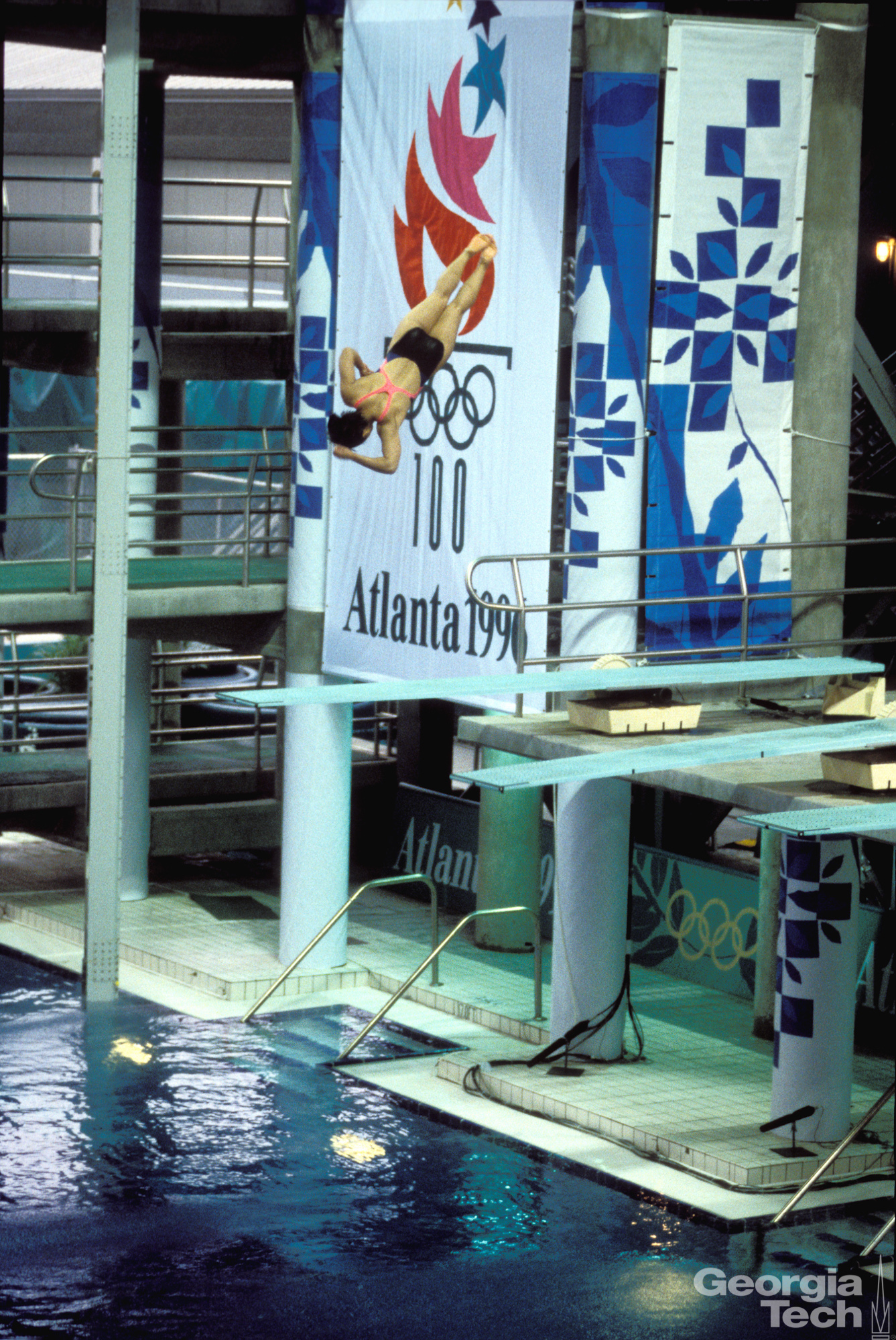 Athlete Jumping From Board in the Aquatic Center